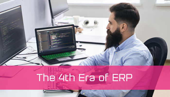 A man working on a computer with a copy strap that reads The 4th era of ERP