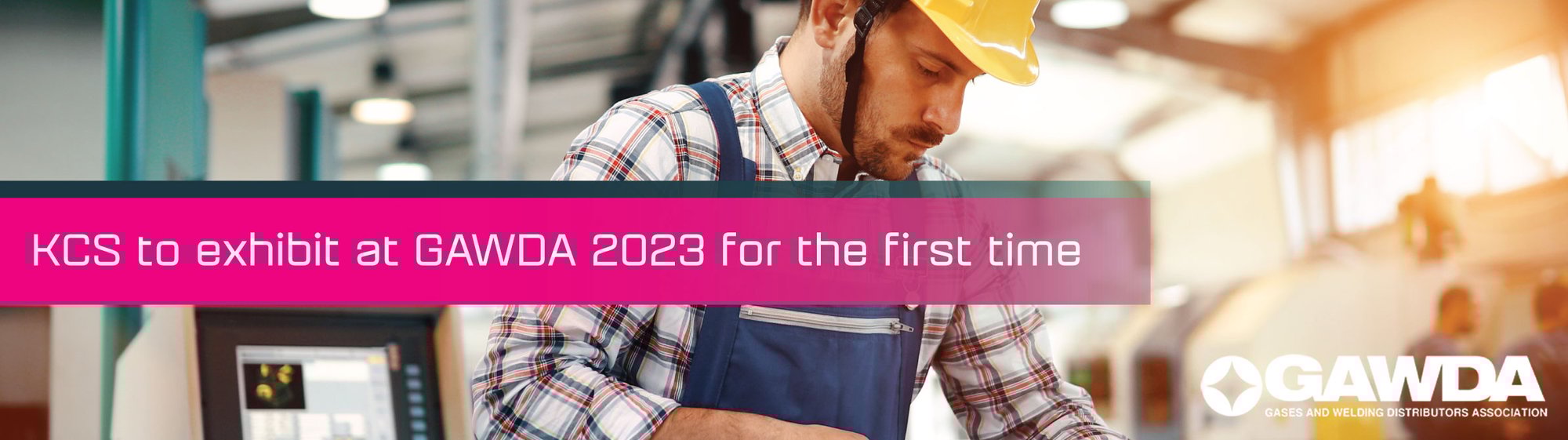 A worker with a hardhat working in a warehouse.